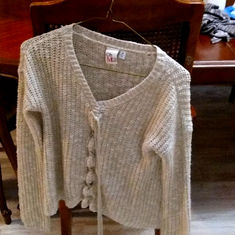 Beige sweater with ties in the front